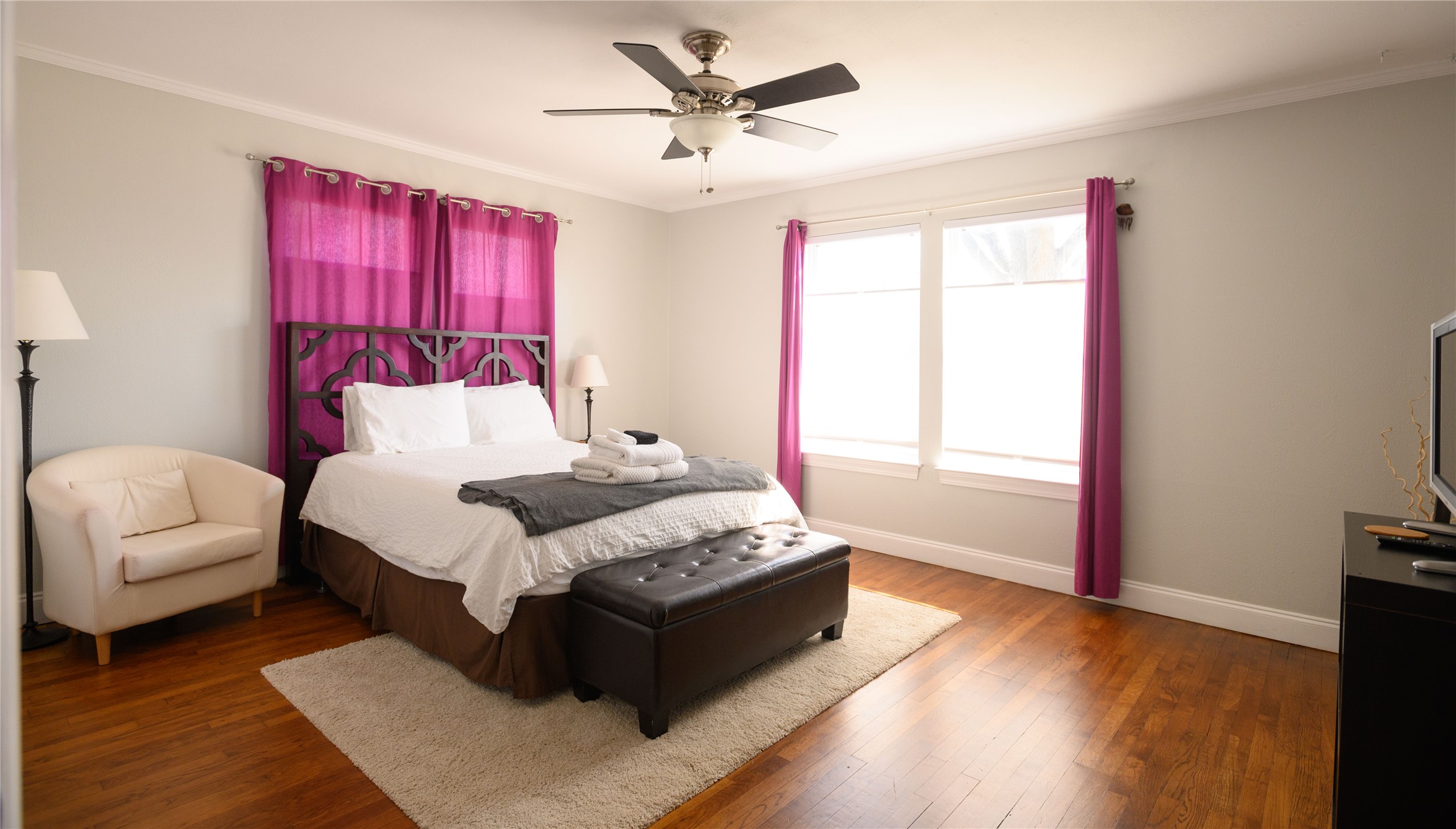 4902 Pecan Springs Road Austin, TX 78723 - Photo 29 of 40 a bedroom with a bed couch and a window