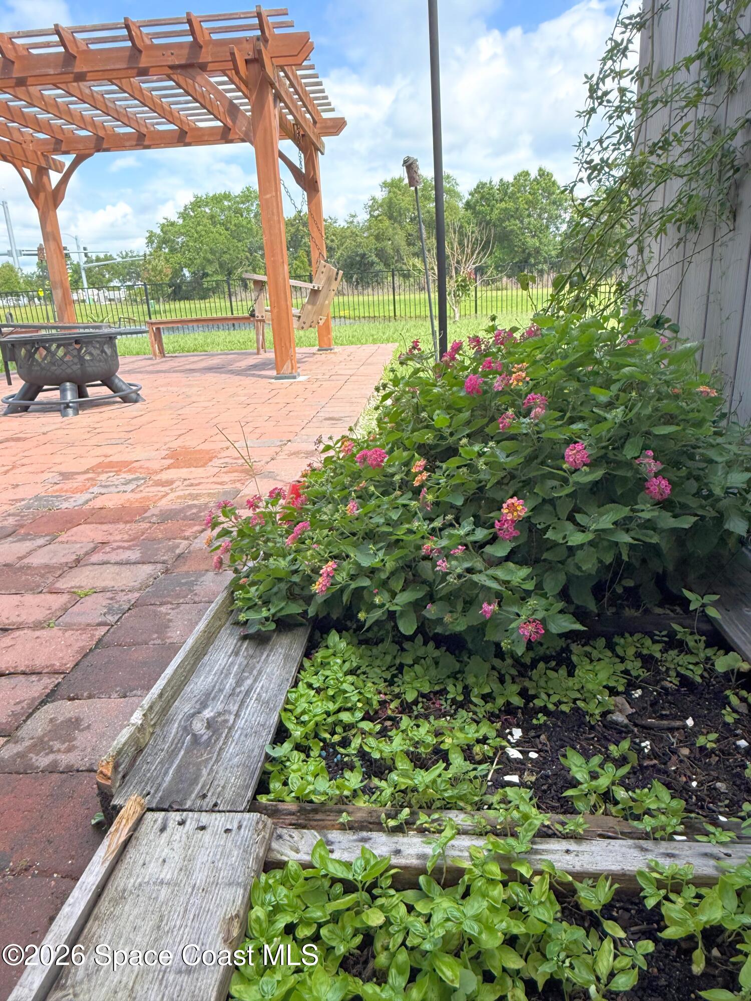 1873 Farmhouse Road Southeast Palm Bay, FL 32909 - Photo 22 of 35 Herb garden