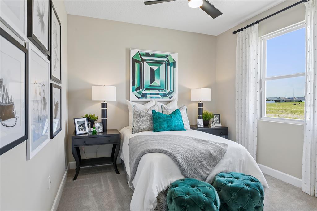 6418 Clover Street Lake Hamilton, FL 33844 - Photo 11 of 14 a bedroom with a bed lamps and a large mirror