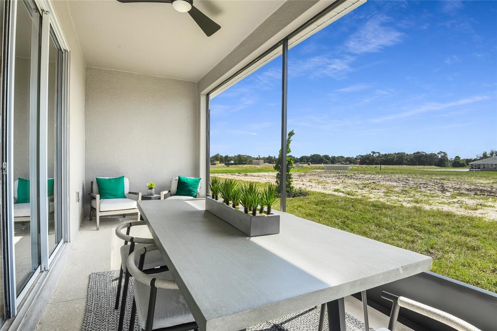 6418 Clover Street Lake Hamilton, FL 33844 - Photo 14 of 14 a view of a balcony with chairs and a table