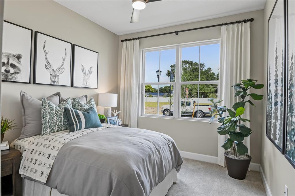 6418 Clover Street Lake Hamilton, FL 33844 - Photo 2 of 14 a bed sitting in a bedroom next to a window