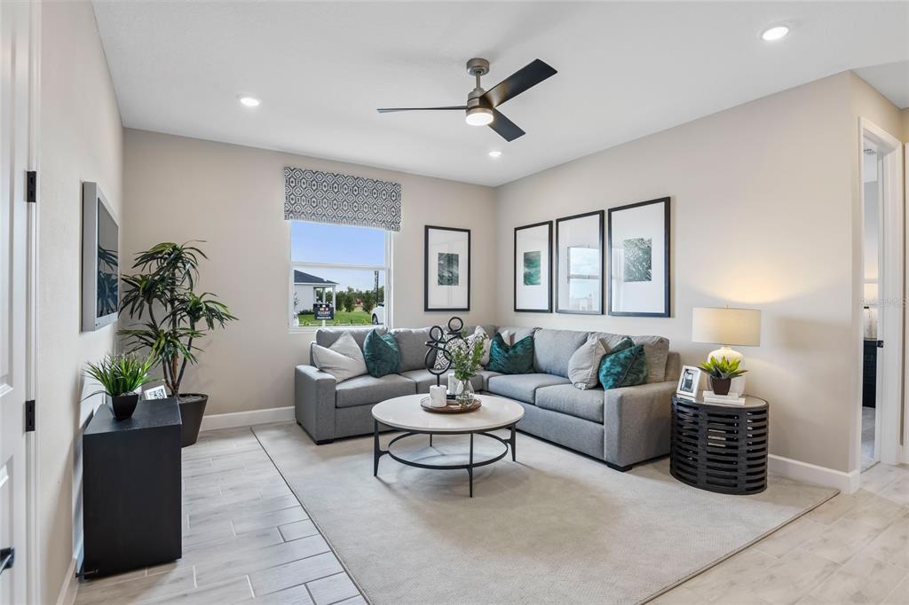6418 Clover Street Lake Hamilton, FL 33844 - Photo 4 of 14 a living room with furniture potted plant and a window