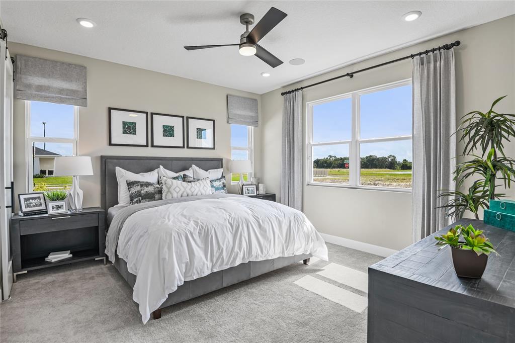 6418 Clover Street Lake Hamilton, FL 33844 - Photo 9 of 14 a bedroom with a bed potted plant and a window