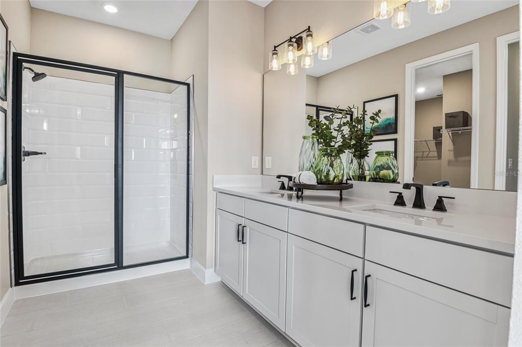 6418 Clover Street Lake Hamilton, FL 33844 - Photo 10 of 14 a bathroom with a double vanity sink and a mirror