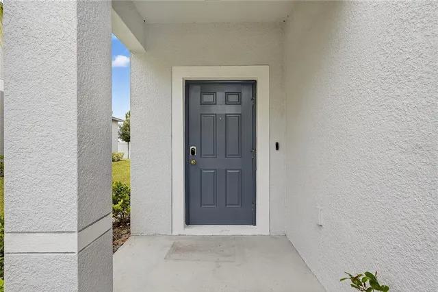 a view of a hallway with furniture and staircase