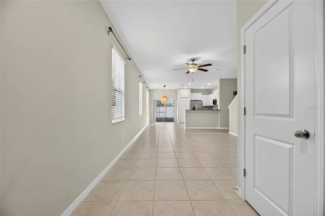 a view of a kitchen with a sink and a window