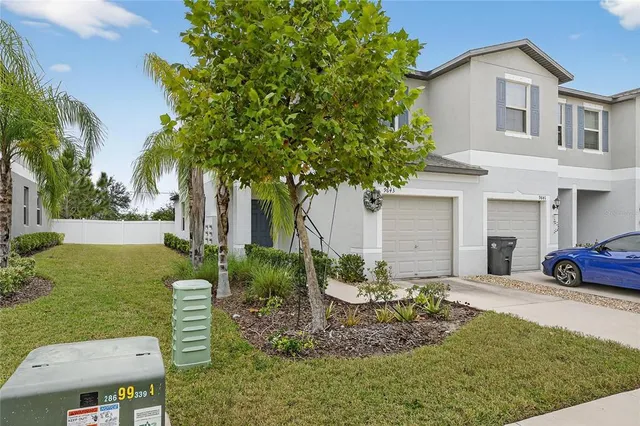 a view of a pathway with house in front of main door