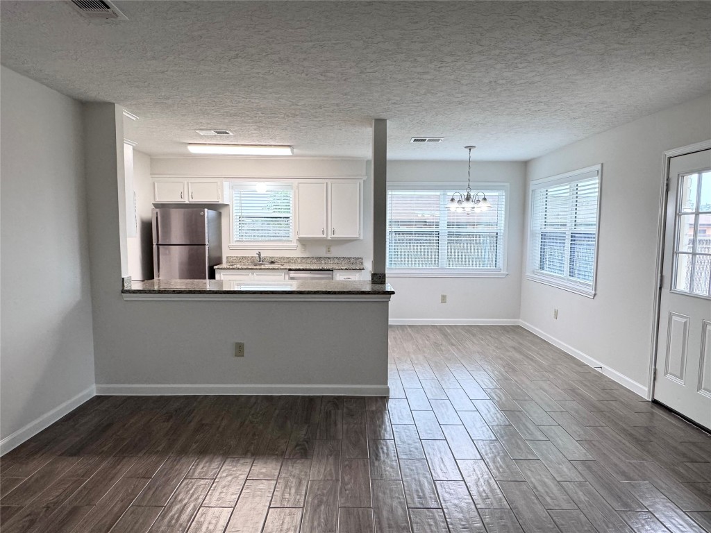 2402 Barak Lane Bryan, TX 77802 - Photo 19 of 25 wooden floor in an empty room with a window
