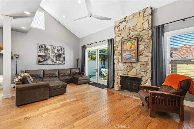 a living room with furniture fireplace and flat screen tv