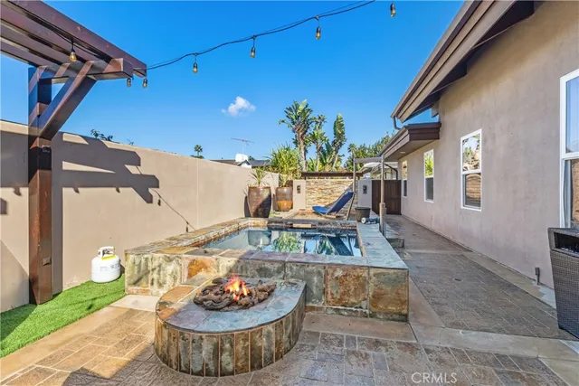 a view of a house with a fountain back yard and a fountain