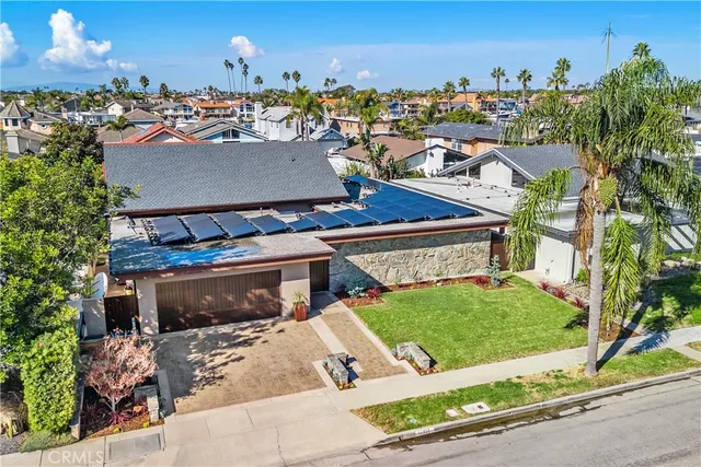 an aerial view of a house with a yard basket ball court and outdoor seating