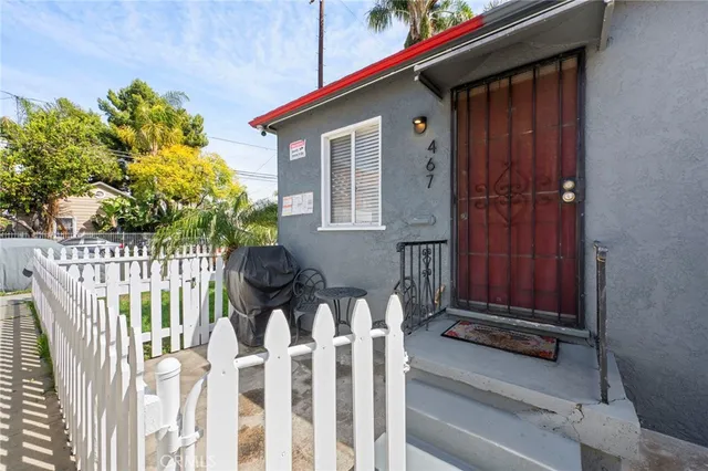 a front view of house with deck and garden
