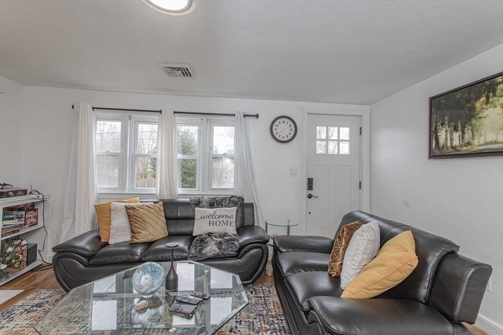 7 Scannell Road Randolph, MA 02368 - Photo 14 of 34 a living room with furniture and a large window