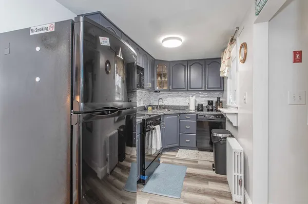 a kitchen with a refrigerator sink and stove