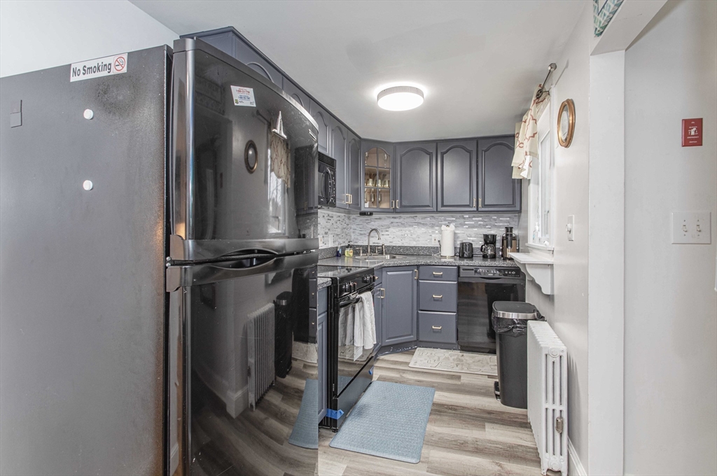 7 Scannell Road Randolph, MA 02368 - Photo 18 of 34 a kitchen with a refrigerator sink and stove