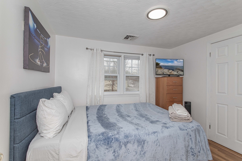 7 Scannell Road Randolph, MA 02368 - Photo 21 of 34 a bedroom with a bed and a window