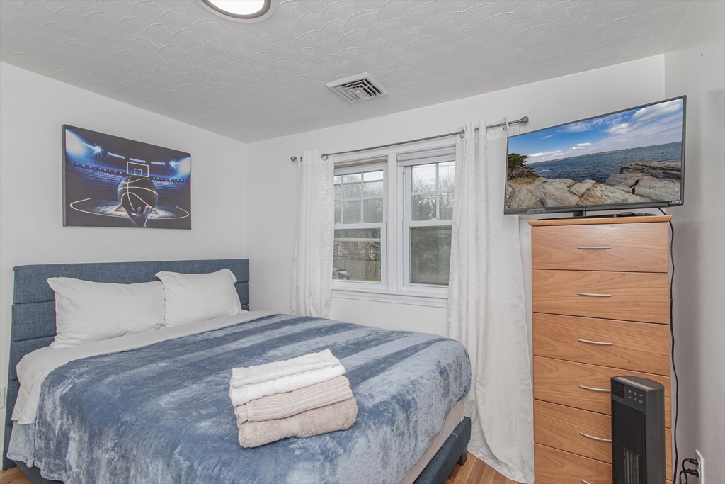 7 Scannell Road Randolph, MA 02368 - Photo 22 of 34 a bedroom with a bed and a window