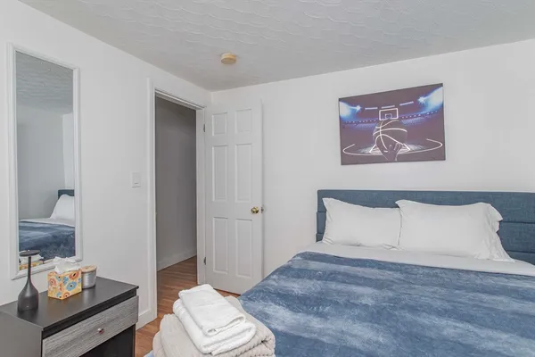 a bedroom with a bed and a couch