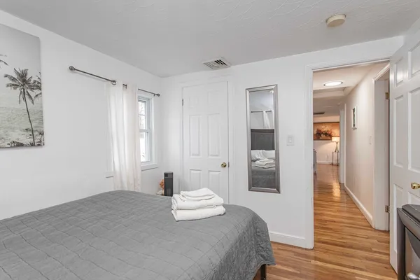 a bedroom with a bed and a walk in closet