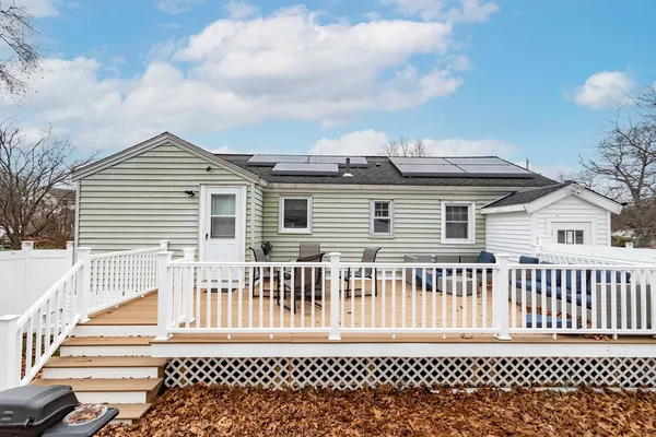 a front view of a house with a fence