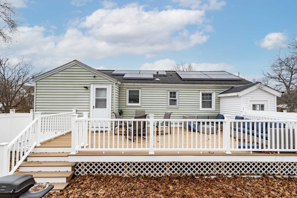 7 Scannell Road Randolph, MA 02368 - Photo 5 of 34 a front view of a house with a fence