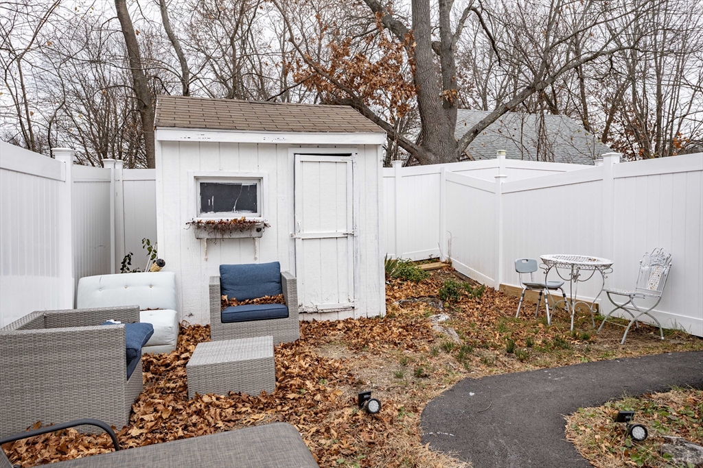 7 Scannell Road Randolph, MA 02368 - Photo 9 of 34 a bed room with a bed and a couch