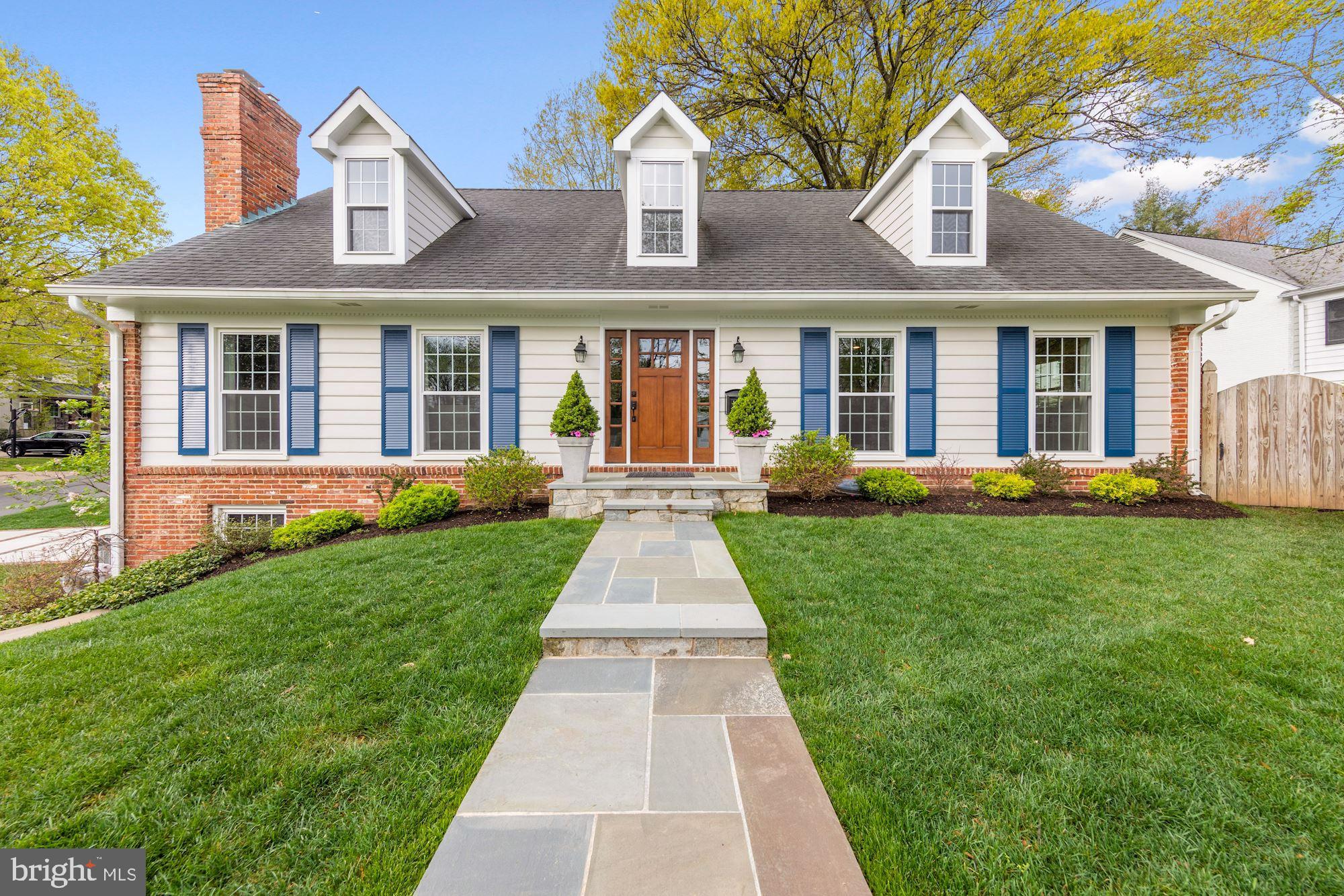 5500 Pollard Road Bethesda, MD 20816 - Photo 3 of 70 a front view of a house with a yard and potted plants