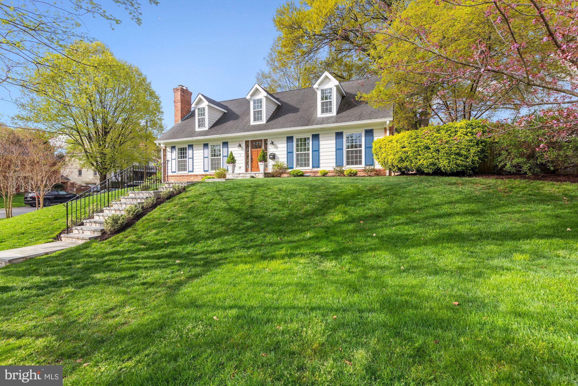 5500 Pollard Road Bethesda, MD 20816 - Photo 5 of 70 a front view of a house with a garden