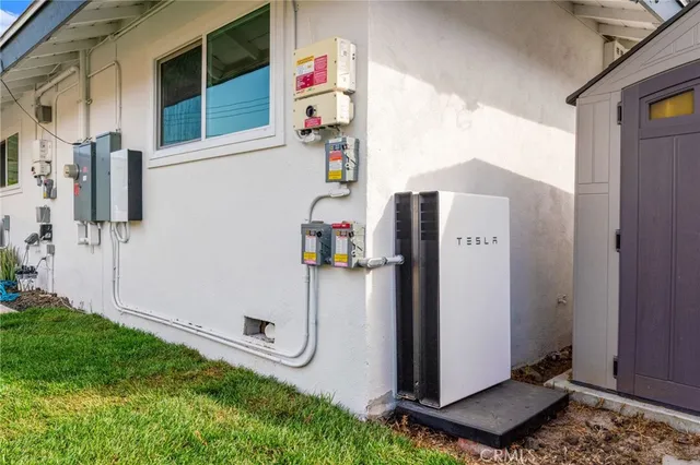 an aerial view of a house with a swimming pool