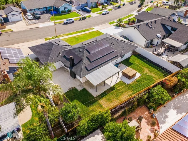 an aerial view of a house with swimming pool