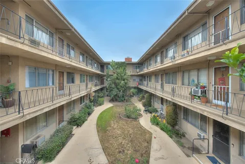 a view of balcony with furniture