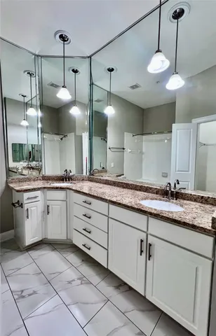 a large kitchen with a lot of counter space and a sink