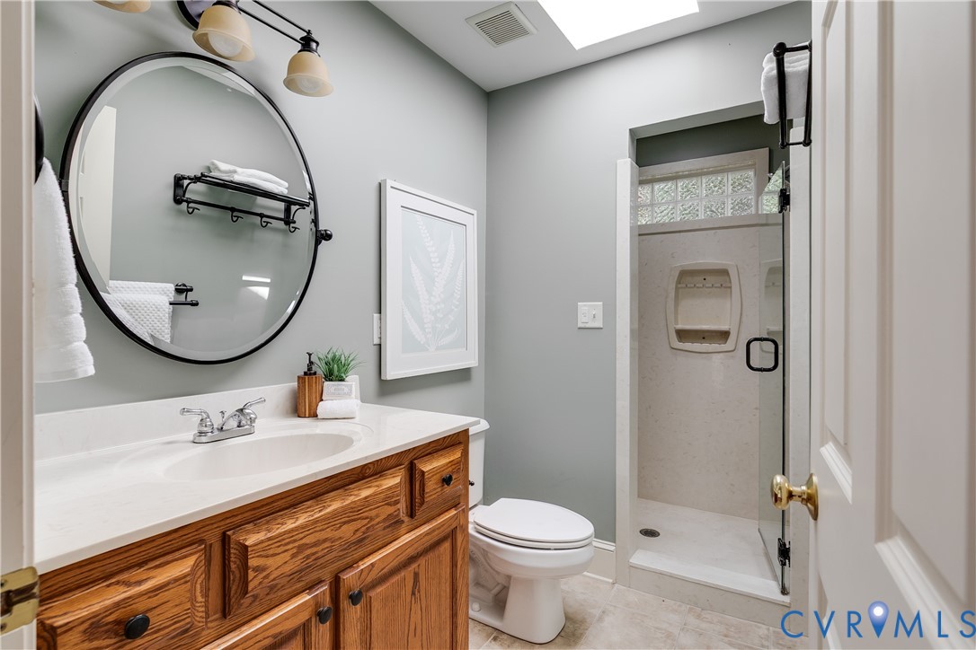 509 Wadeward Road Henrico, VA 23229 - Photo 38 of 59 a bathroom with a toilet a sink and mirror