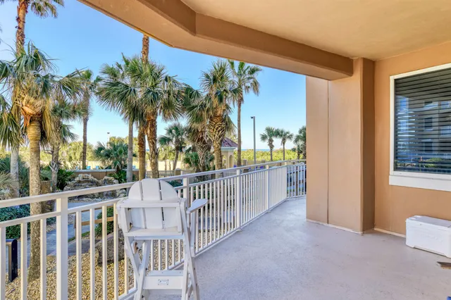 a view of balcony with a palm tree