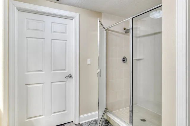 a bedroom with bed and a window