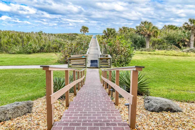 a view of swimming pool with seating space
