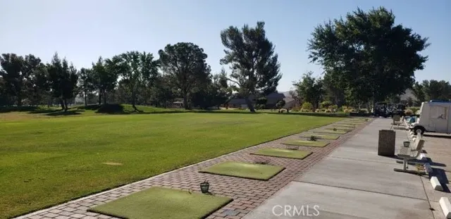 a view of a swimming pool and lounge chairs