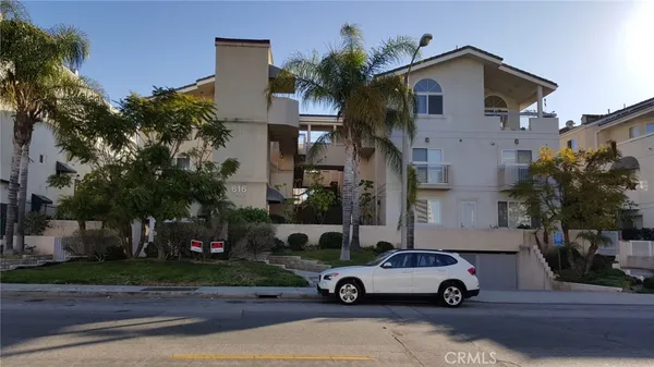 a car parked in front of a house