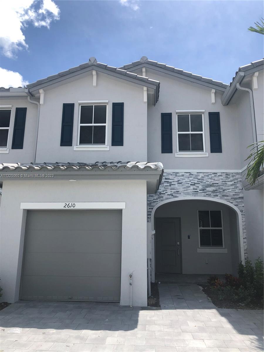 2610 Southeast 13th Street Homestead, FL 33035 - Photo 1 of 17 a front view of a house with a garage