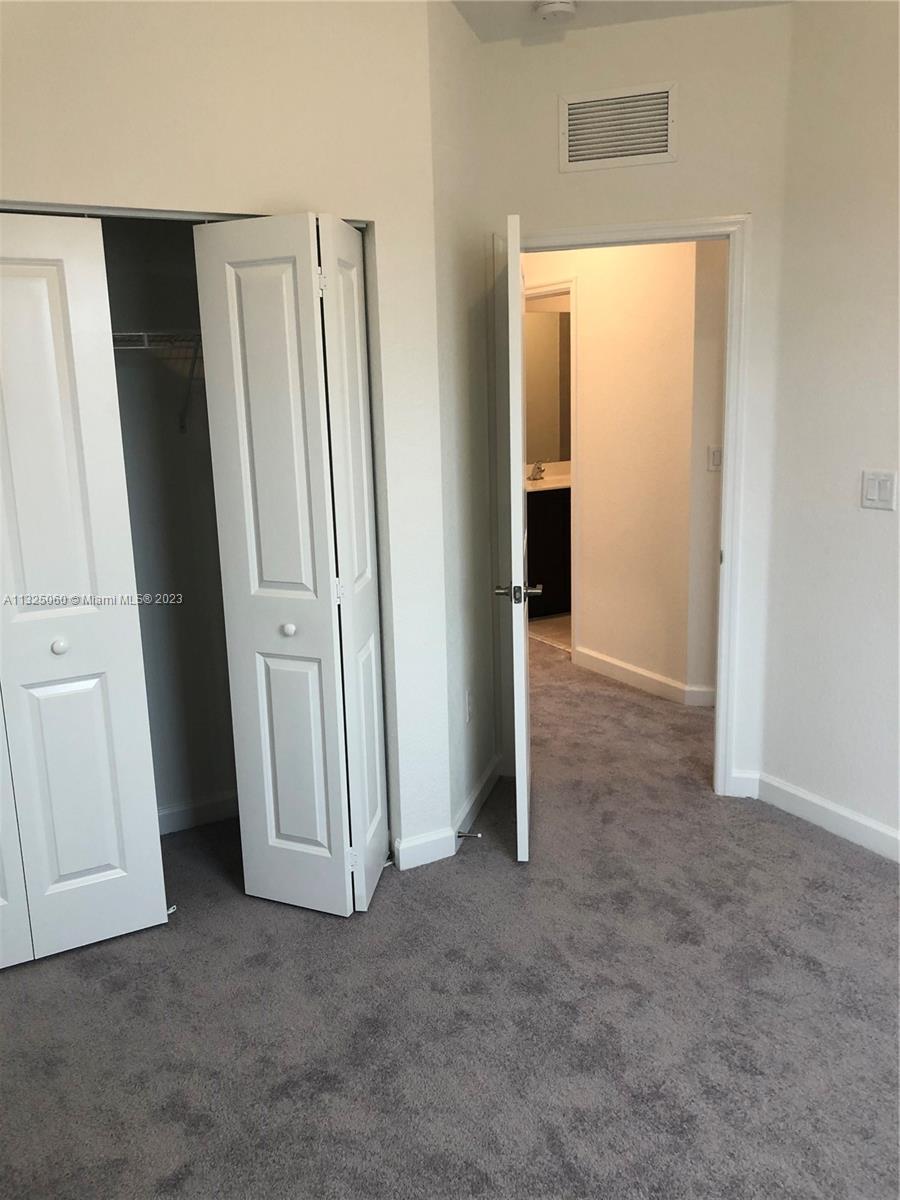 2610 Southeast 13th Street Homestead, FL 33035 - Photo 10 of 17 an empty room with windows