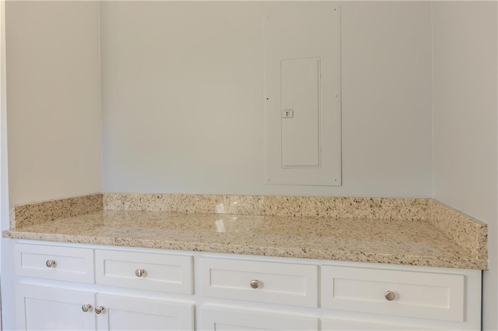 53 Washington Drive Forsyth, GA 31029 - Photo 7 of 19 a view of granite countertop white cabinets and a granite counter tops