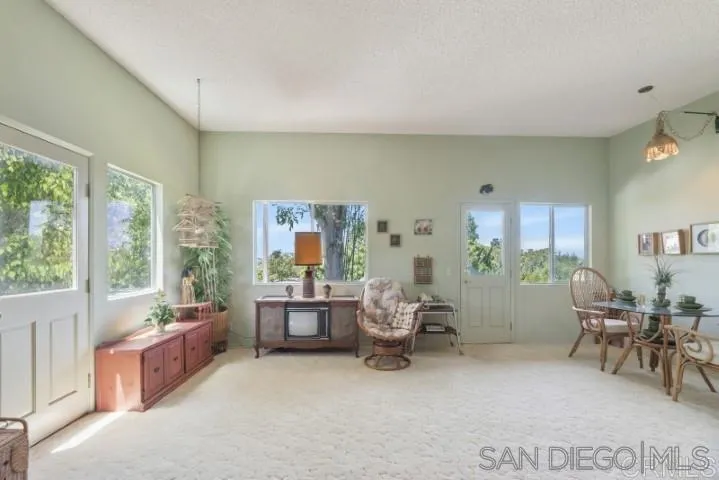 1660 Burgundy Road Encinitas, CA 92024 - Photo 17 of 25 a living room with furniture and a large window