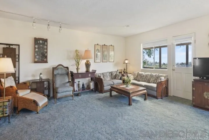 1660 Burgundy Road Encinitas, CA 92024 - Photo 2 of 25 a living room with furniture and a window