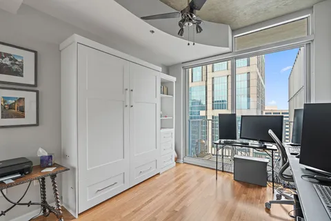 a bathroom with a granite countertop tub sink toilet and mirror