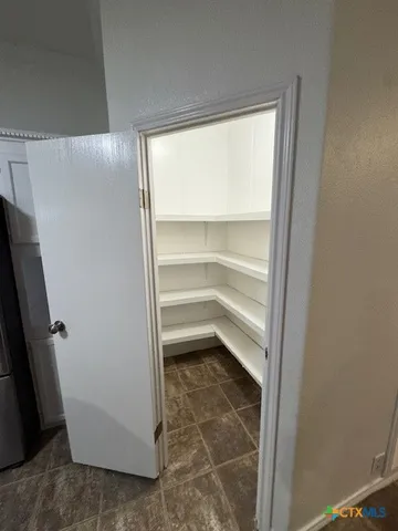 a storage room with washer and dryer