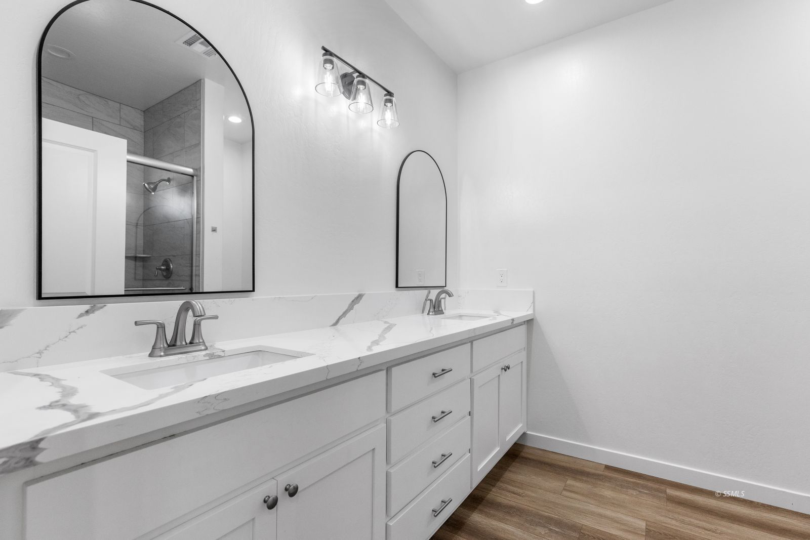 1112 Vulcan Ridgecrest, CA 93555 - Photo 15 of 30 a bathroom with a double vanity sink and mirror