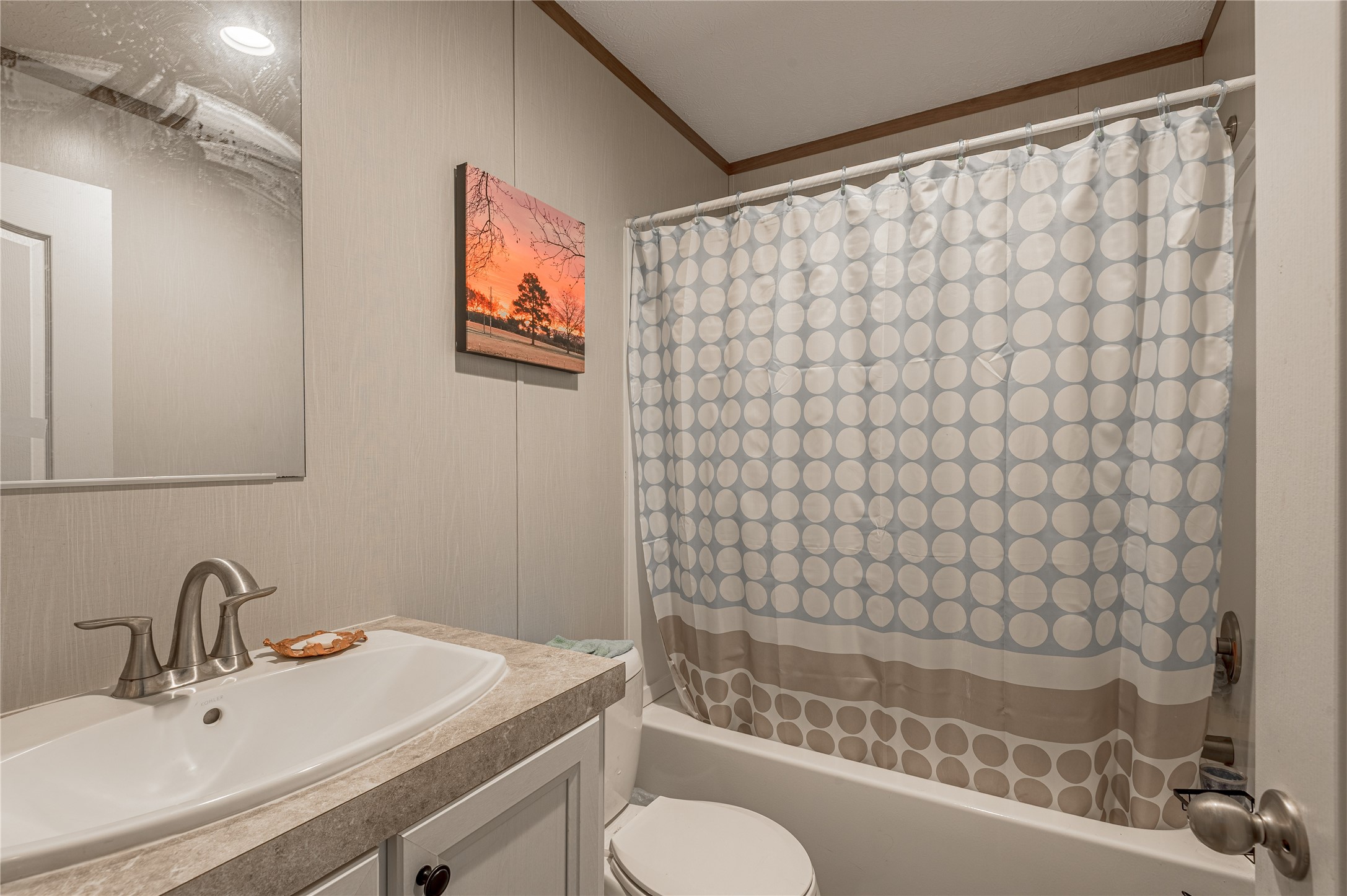 998 East 1st Street Groveton, TX 75845 - Photo 14 of 25 a bathroom with a sink and a bathtub