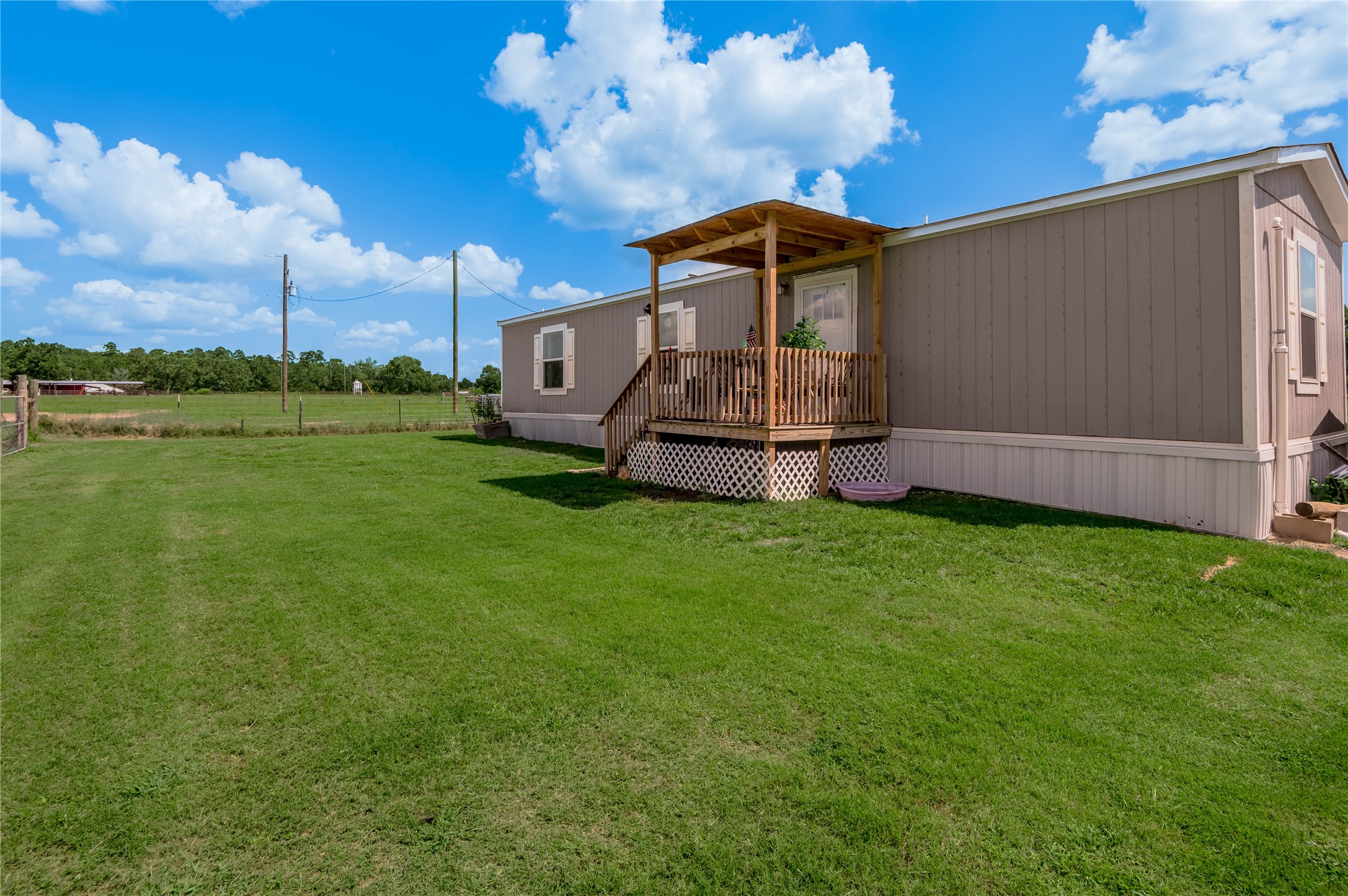 998 East 1st Street Groveton, TX 75845 - Photo 15 of 25 a front view of a house with garden