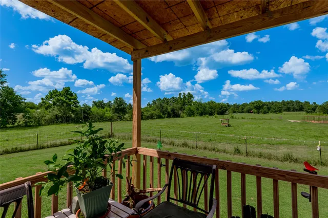 a view of a porch with a big yard