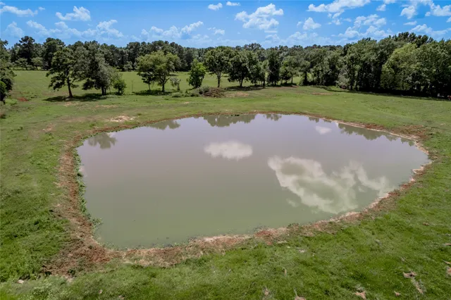 a view of a golf course with a lake